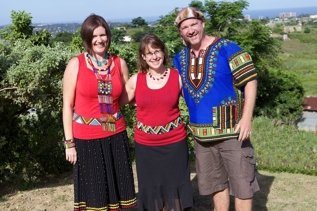 Kerry, Lois and Dan model their traditional Zulu outfits.